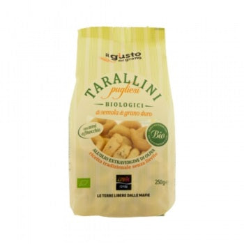 Tarallini Pugliesi ai Semi di Finocchio Bio, 1 Beutel, 250 g. Tarallini aus Apulien mit Weißwein und Olivenöl extra Vergine und Fenchel.  Die Fenchelsamen verfeinern die Rezeptur und verleihen den Tarallini einen einzigartigen mediterranen Geschmack.  Ideal als Häppchen zum Aperitif oder leckerer Snack.